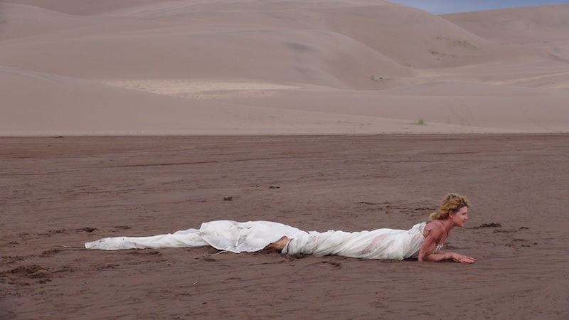 Ana Baer filming Kim Olson at the Great Dunes, Colorado, USA. A collaborative project with Syzygy Butoh and Sweet/Edge, 2014. Image courtesy of Ana Baer.