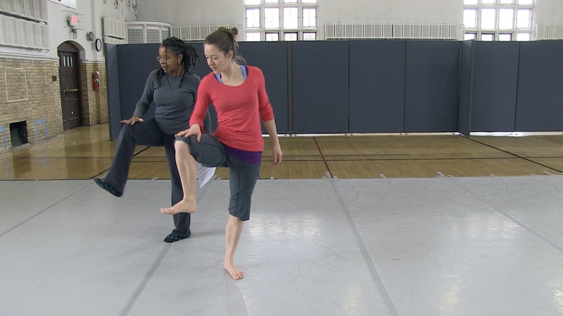 Bebe Miller (L) and project assistant Ellie Escosa-Carter choreographing Globe Trot. (frame grab)