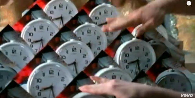 Screenshot of the many alarm clocks from the opening of the video, "Let Forever Be."