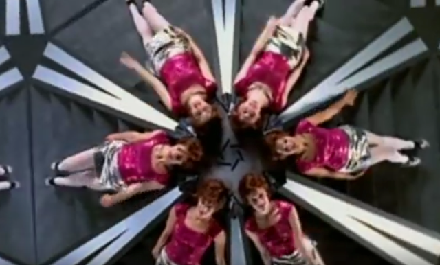 Screenshot of the disco dancers in Berkeley-esque kaleidoscope formation from the video "Let Forever Be."