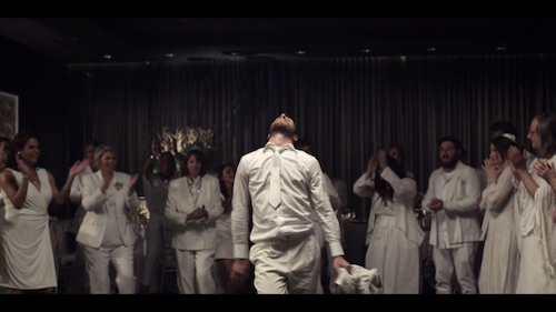 Cousin Simon (Bashir Naim) dances in the middle of the Horah scene. Screenshot taken by the author.